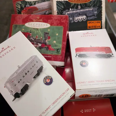 Sale Photo Thumbnail #41: Collection of boxed Hallmark Keepsake Lionel train Christmas ornaments in original packaging.