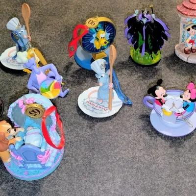 Sale Photo Thumbnail #43: Collection of Disney Hallmark Keepsake Christmas ornaments, including classic characters like Mickey, Minnie, Pinocchio, Remy, and Maleficent.