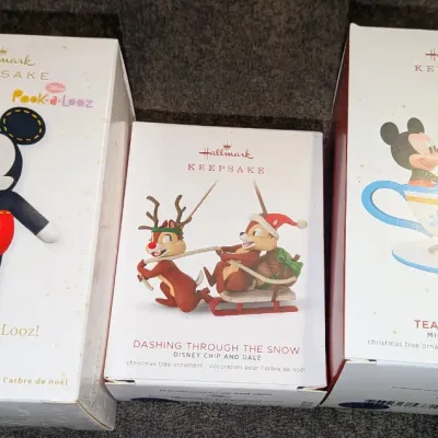 Sale Photo Thumbnail #48: Trio of Disney Hallmark Keepsake Christmas tree ornaments in their original boxes, including Mickey Mouse and Chip and Dale designs.