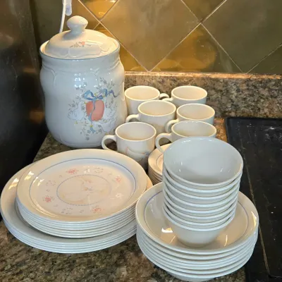 Sale Photo Thumbnail #18: Vintage ceramic dinnerware set featuring a country goose motif, including a large cookie jar, mugs, plates, and stacked bowls.