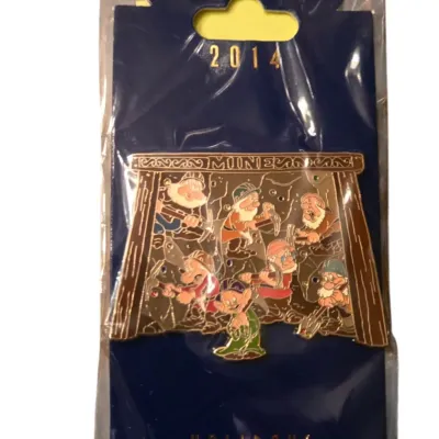 Sale Photo Thumbnail #32: Walt Disney Imagineering 2014 Holidays Seven Dwarfs Mine enamel pin, sealed in original plastic packaging on blue backing card.