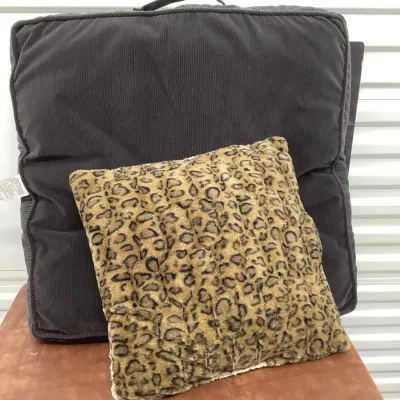 Dog Bed And A Leopard Print Pillow