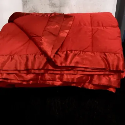 A Modern Quilt Comforter  With A Smooth  Border