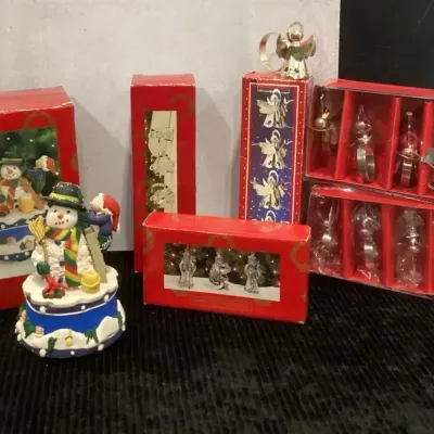 Four BoxesSilver Plate Napkin Holders, Set Of Three Silver Plate Santa Ornaments, Musical Snowman 