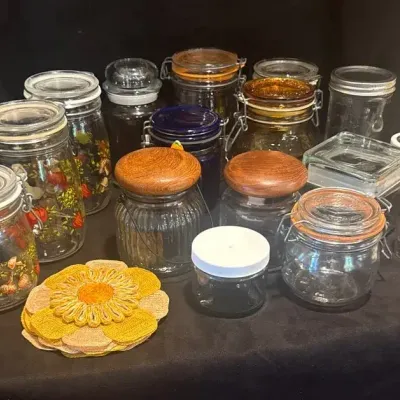 Vintage Glass Storage Containers And Needlepoint Wall Hanging