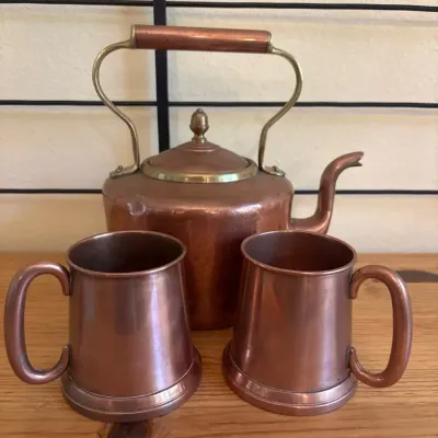 Copper And Brass Accented Tea Kettle And Mugs