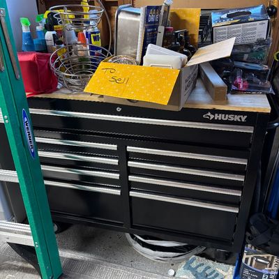 Black Husky rolling tool chest cabinet with a wood top