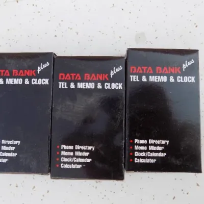 Trio of vintage Data Bank Plus electronic organizers in their original boxes, featuring telephone directory, memo, clock, and calculator...