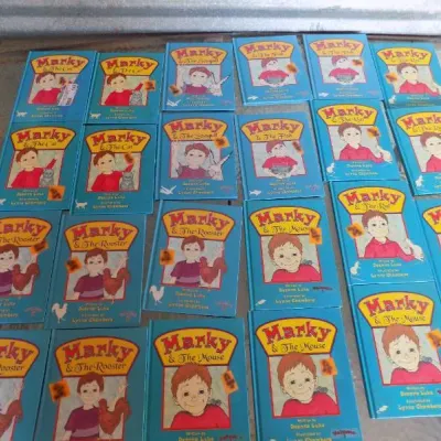 Collection of Marky series children's paperback books by Deanna Luke with illustrations by Lynne Chambers, laid out on a table.