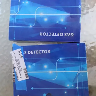 Two boxed electronic gas detectors in blue original packaging.