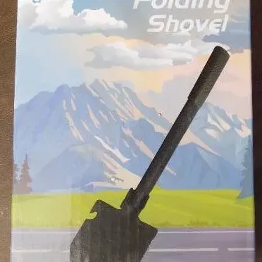 Boxed multi-purpose camping folding shovel featuring an integrated pick, saw edge, and bottle opener.