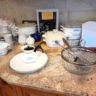 Collection of vintage CorningWare Corning Cornflower pattern cookware and serving dishes, including casserole dishes, a teapot, and a...