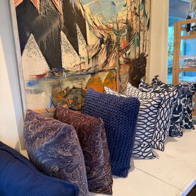 Large mid-century abstract impasto oil painting on canvas paired with a collection of decorative throw pillows in varied blue and pattern...