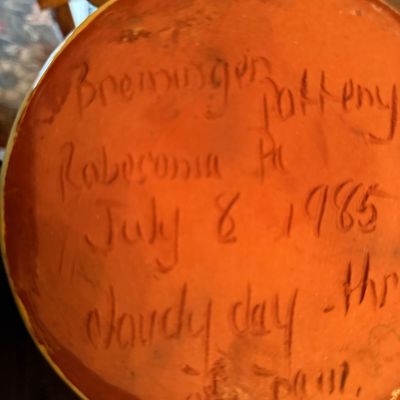 Handwritten maker's mark on the underside of a Breininger Pottery redware piece from Robesonia, Pennsylvania, dated July 8, 1985.