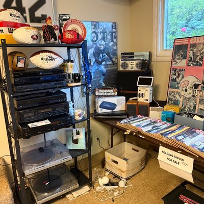 Collection of sports memorabilia, audio equipment, and San Francisco 49ers collectibles, including signed footballs, a Ronnie Lott framed...