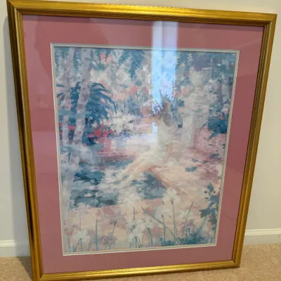 Sale Photo Thumbnail #15: Framed impressionistic print depicting a woman sitting by a garden pool, housed in a gold metallic frame with a dusty rose mat board.