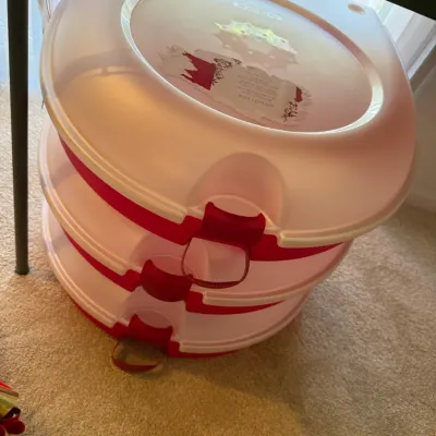 Sale Photo Thumbnail #31: Stack of three clear and red plastic holiday wreath storage boxes with red latches.
