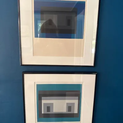 Pair of framed Josef Albers style geometric color field screenprints in matching thin black frames.