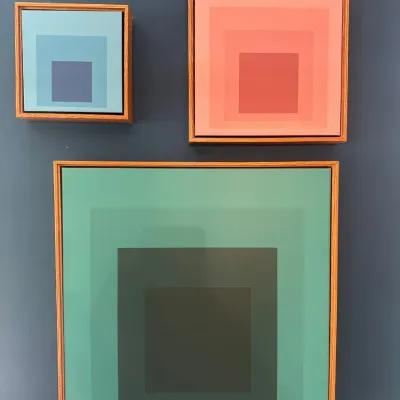 Set of three Josef Albers style 'Homage to the Square' geometric abstract framed prints in wood float frames.