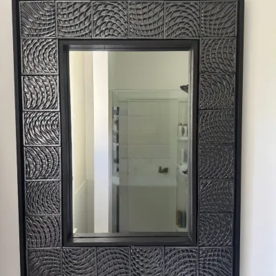 Contemporary rectangular wall mirror featuring a dark metallic frame with relief-patterned tile accents.