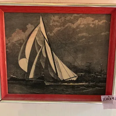 Framed vintage nautical engraving depicting a sailboat at sea, presented in a red wood frame measuring 11.25 inches by 9.25 inches.