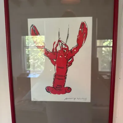 Framed pop art style lobster print, numbered and signed in pencil, housed in a matching red frame with grey matting.
