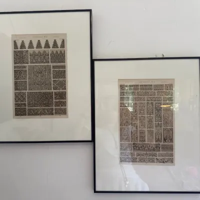 Pair of framed vintage architectural design prints featuring Arabian decorative pattern plates in thin black frames.