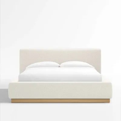 Sale Photo Thumbnail #17: Crate and Barrel Modern platform bed frame upholstered in off-white textured fabric with a low wooden base.