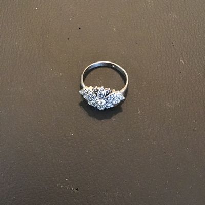 Sale Photo Thumbnail #211: Vintage-style marcasite cluster statement ring featuring an intricate floral/starburst design set with marcasite accents and a central stone. Shown on a ring mandrel measuring approximately size 9.5 (US size 9 1/2). Good pre-owned condition with light sur