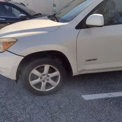 Sale Photo Thumbnail #5: Toyota RAV 4 with 195,000 miles.  This is a cash, cashier's check or wire transfer purchase only.  Sold as is with no warranty or guarantees.  Vehicle has obvious exterior damage to rear and front bumpers and passenger side panels.  Interior will need det