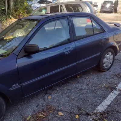 Sale Photo Thumbnail #43: 1999 Mazda Protege This is a cash, cashier's check or wire transfer purchase only.  Sold as is with no warranty or guarantees.  Vehicle has obvious exterior paint issues with some minor damage to rear and front bumpers and side panels.  Interior will need