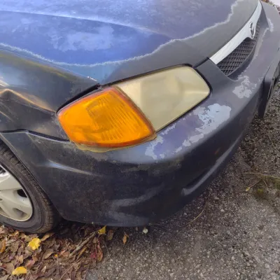 Sale Photo Thumbnail #44: 1999 Mazda Protege This is a cash, cashier's check or wire transfer purchase only.  Sold as is with no warranty or guarantees.  Vehicle has obvious exterior paint issues with some minor damage to rear and front bumpers and side panels.  Interior will need