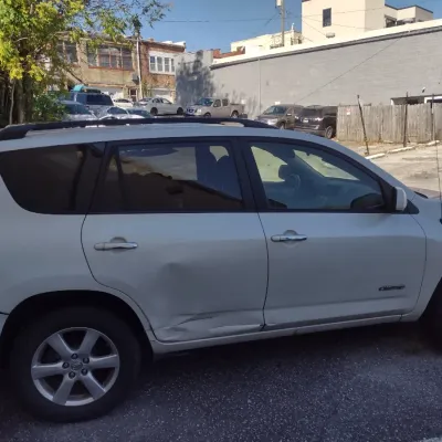 Sale Photo Thumbnail #7: Toyota RAV 4 with 195,000 miles.  This is a cash, cashier's check or wire transfer purchase only.  Sold as is with no warranty or guarantees.  Vehicle has obvious exterior damage to rear and front bumpers and passenger side panels.  Interior will need det