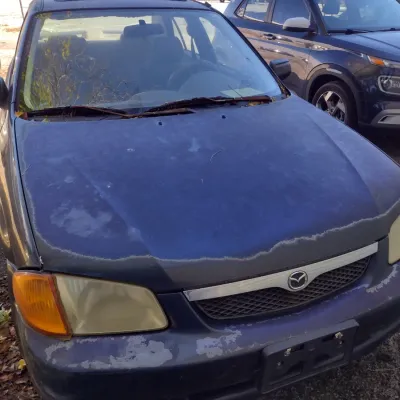 Sale Photo Thumbnail #45: 1999 Mazda Protege This is a cash, cashier's check or wire transfer purchase only.  Sold as is with no warranty or guarantees.  Vehicle has obvious exterior paint issues with some minor damage to rear and front bumpers and side panels.  Interior will need