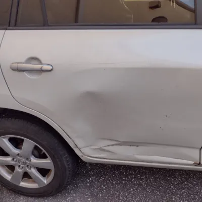 Sale Photo Thumbnail #9: Toyota RAV 4 with 195,000 miles.  This is a cash, cashier's check or wire transfer purchase only.  Sold as is with no warranty or guarantees.  Vehicle has obvious exterior damage to rear and front bumpers and passenger side panels.  Interior will need det