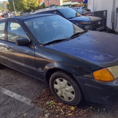 Sale Photo Thumbnail #47: 1999 Mazda Protege This is a cash, cashier's check or wire transfer purchase only.  Sold as is with no warranty or guarantees.  Vehicle has obvious exterior paint issues with some minor damage to rear and front bumpers and side panels.  Interior will need