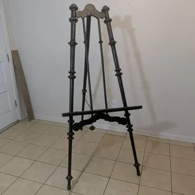 Sale Photo Thumbnail #32: Vintage dark wood floor-standing display easel with turned spindle supports and decorative cresting.