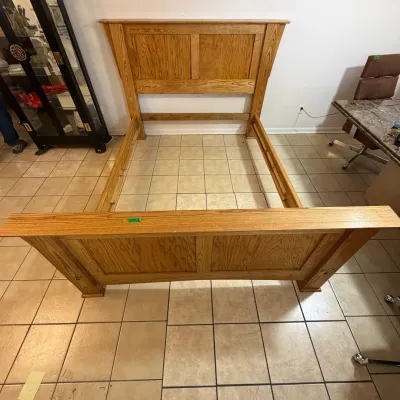 Sale Photo Thumbnail #54: Mission Style solid oak wooden bed frame featuring a paneled headboard, matching footboard, and side rails.