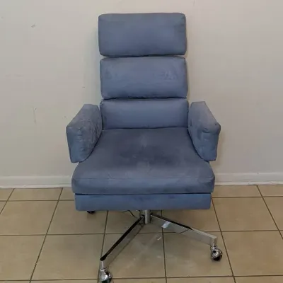 Sale Photo Thumbnail #7: Modern executive office chair upholstered in blue velour fabric, featuring a tiered backrest and chrome swivel base on casters.