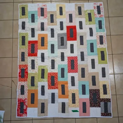 Sale Photo Thumbnail #22: Handmade patchwork quilt featuring a geometric, modern block pattern with colorful framed dark rectangular centers.