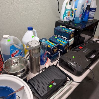 Sale Photo Thumbnail #83: Microwave, pots and pans, cleaning supplies and Vacuum sealer.
