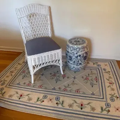 Floral Duhry Rug w/ Blue & White Patterned Wicker Chair & Ceramic Stool