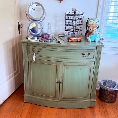 Sale Photo Thumbnail #50: Sage green painted wooden vanity cabinet, various vanity mirrors, costume jewelry, and plush owl toys