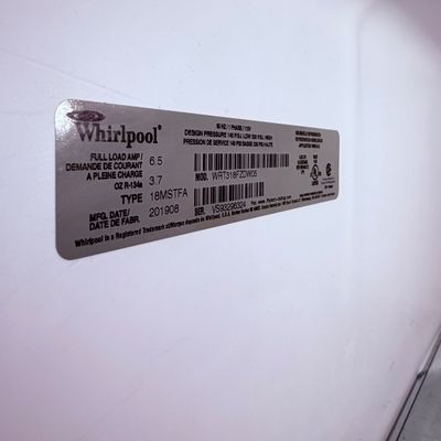 Sale Photo Thumbnail #60: Whirlpool refrigerator manufacturer label indicating model number WRT318FZDW05 and manufacturing date of August 2019.