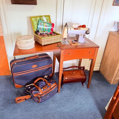 Sale Photo Thumbnail #26: Vintage electric sewing machine mounted in a wooden drop-leaf table