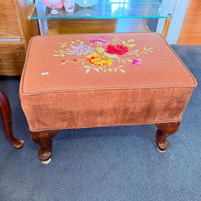 Sale Photo Thumbnail #37: Vintage padded ottoman with needlepoint floral top design, brown velvet skirt, and cabriole wooden legs.