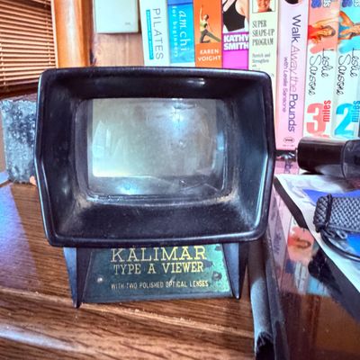 Sale Photo Thumbnail #76: Vintage Kalimar Type A slide viewer, featuring a black plastic housing with twin optical lenses