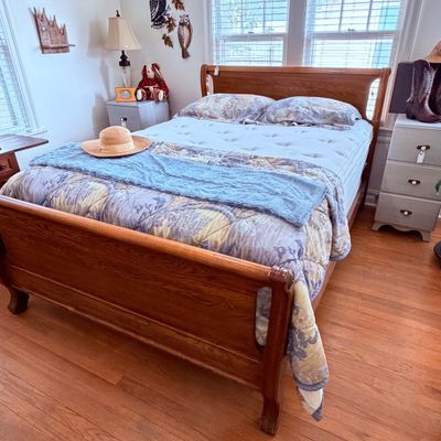 Sale Photo Thumbnail #44: Traditional wooden bed frame with a a very newer pillow top mattress