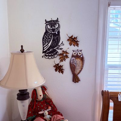 Sale Photo Thumbnail #57: Collection of decorative wall art featuring owl figures and copper oak leaves, a traditional table lamp and a plush rabbit doll.