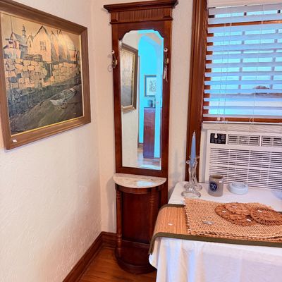 Sale Photo Thumbnail #12: Vintage tall mahogany hall tree with a full-length mirror, marble demi-lune shelf, and coat hooks